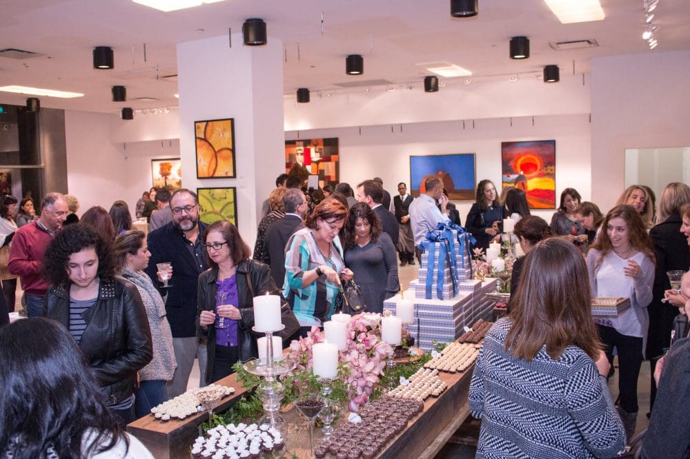 Mingling amongst delicious treats and a beautiful collection of artwork
