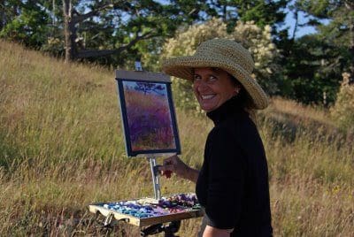 The artist in the field doing a study en plein air