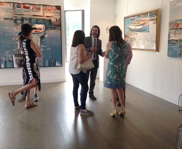 Kote speaking with guests at the Haverford gallery