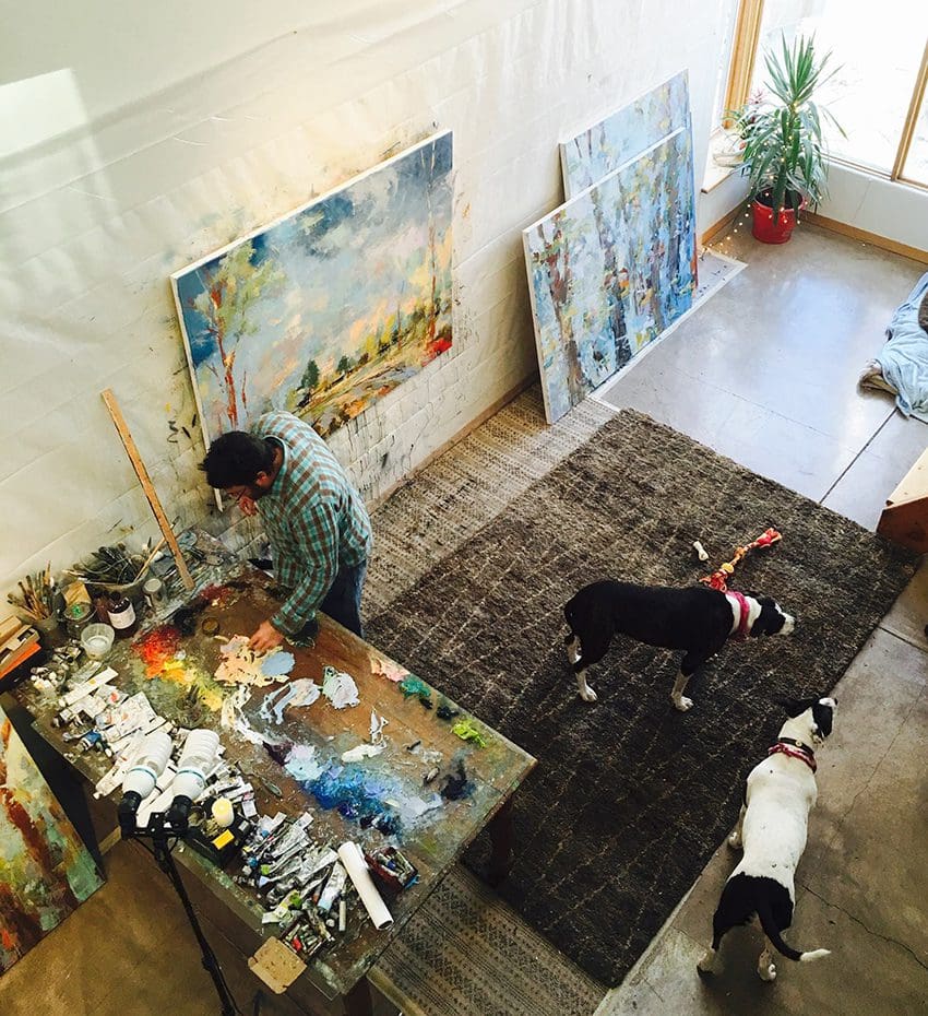 Noah Desmond in the studio with his two dogs